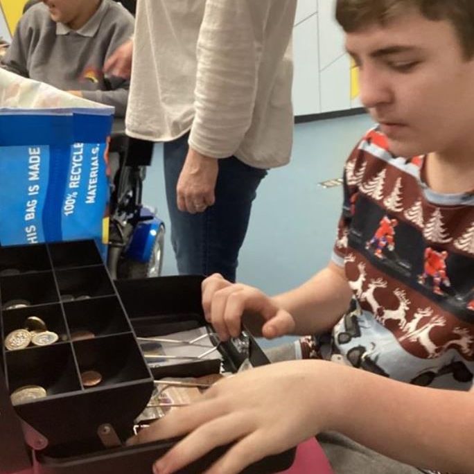 Learning to use a cash register