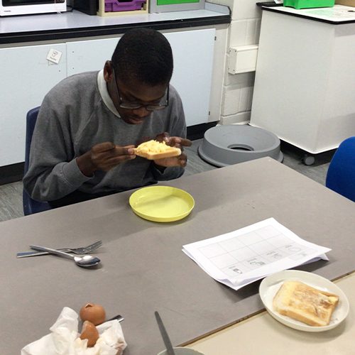 Learning how to make scrambled eggs on toast