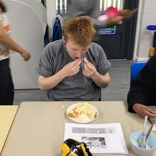 Learning how to make scrambled eggs on toast