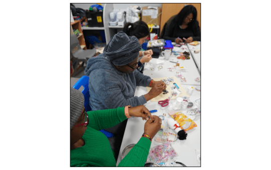 Parents involved in a craft session