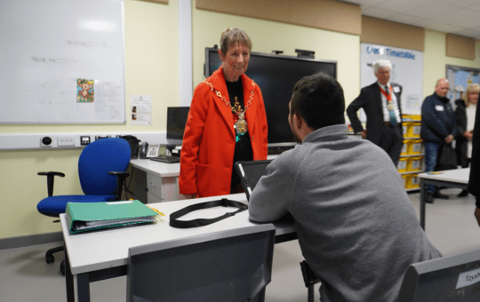The Mayor of the Royal Borough of Greenwich talking with a CPA pupil