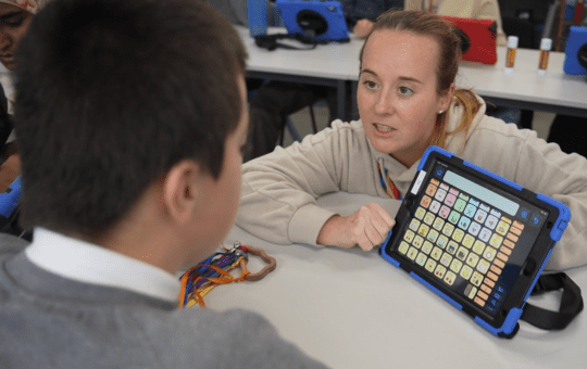 Charlton Park Academy student in class with their teacher Charlton Park Academy student in class with their teacher